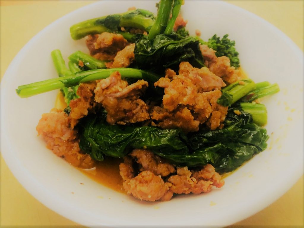 Broccoli Rabe with Spicy Sausage: 5 Tips for Bold Flavor 11 broccoli rabe with spicy sausage in a white bowl with butter sauce and red pepper flakes