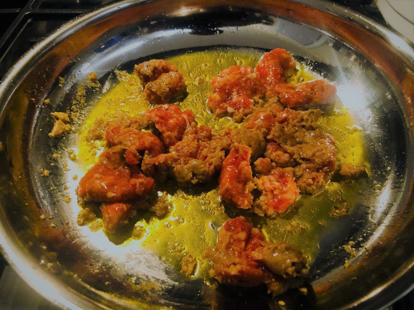 Broccoli Rabe with Spicy Sausage: 5 Tips for Bold Flavor 5 spicy Italian sausage rendering in a saute pan for broccoli rabe with spicy sausage recipe