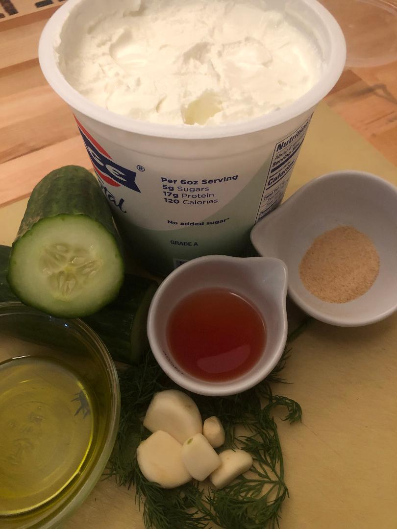 Quick Tzatziki Sauce in 15 Minutes: 6-Ingredient Greek Yogurt Dip 3 quick tzatziki sauce in a white ceramic bowl with olive oil drizzle and fresh dill