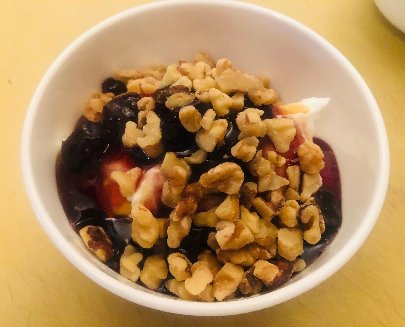 Greek Yogurt Parfait: 5 Layers for a Heavenly Breakfast 3 Greek yogurt parfait with honey, cherries, granola, and walnuts in a glass bowl
