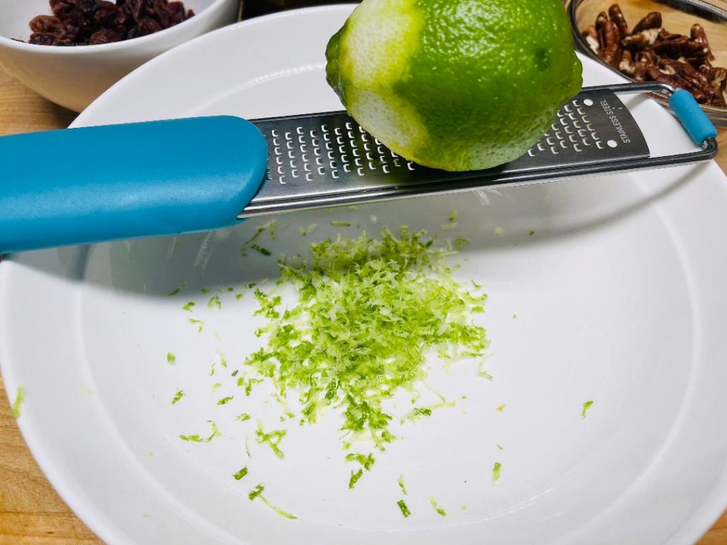 adding fresh thyme sprigs to the dressing