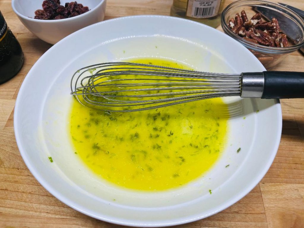 finished thyme vinaigrette ready to drizzle over salad