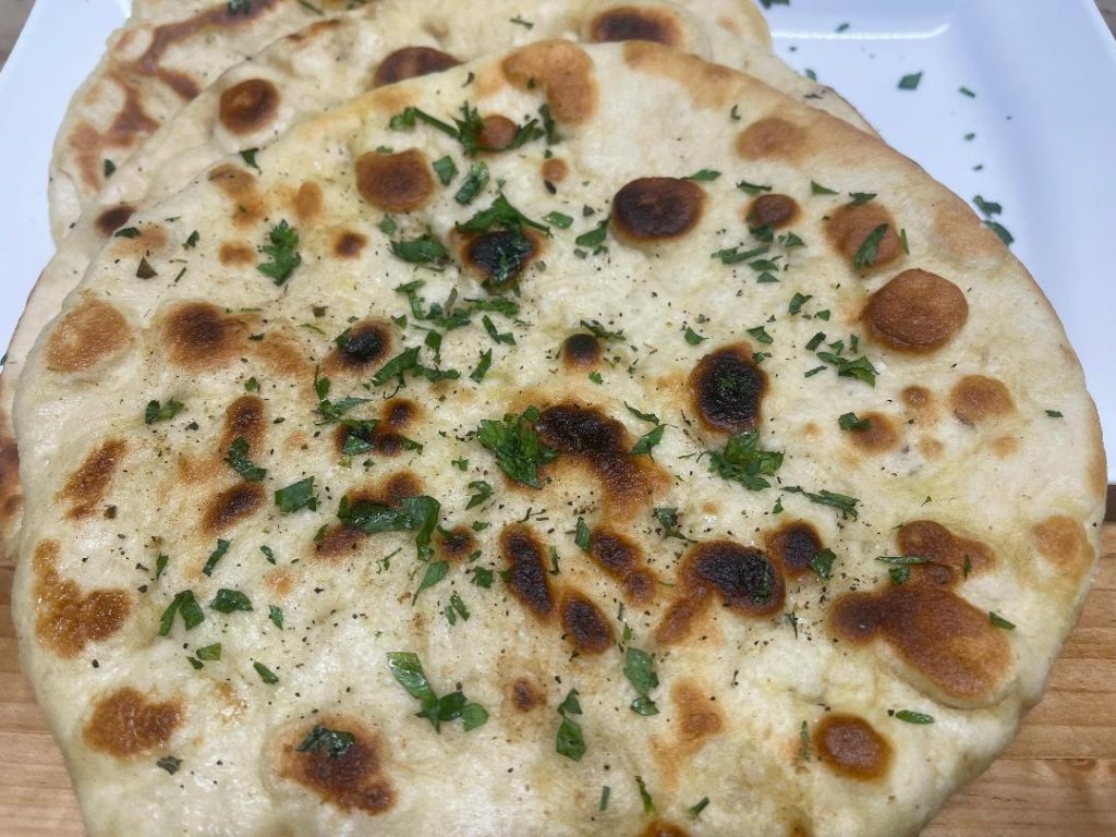 Homemade Pita Bread Recipe: Soft, Fresh & Ready in 90 Minutes 15 pita bread dough ball on floured surface