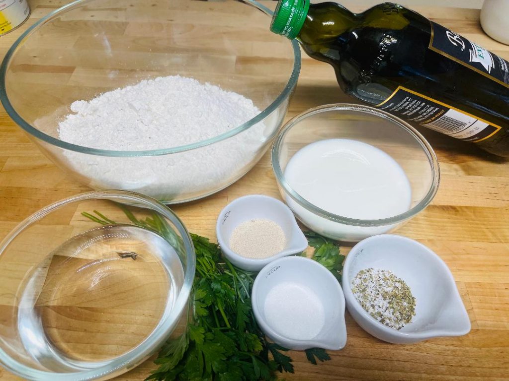 Homemade Pita Bread Recipe: Soft, Fresh & Ready in 90 Minutes 4 mixing homemade pita bread dough in a bowl