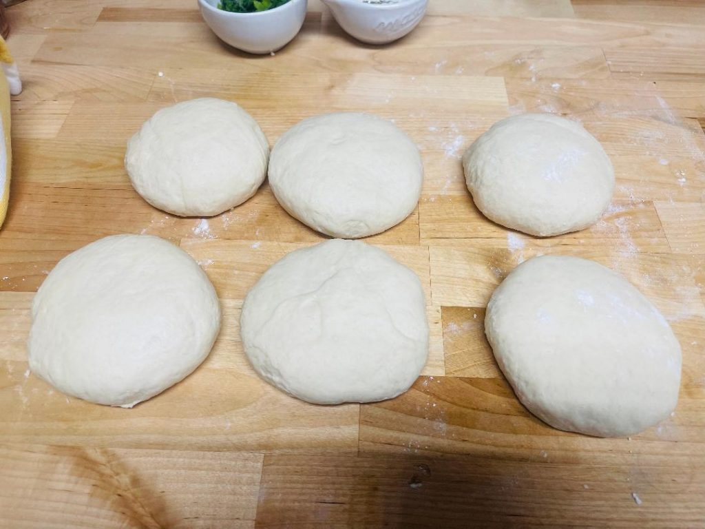 Homemade Pita Bread Recipe: Soft, Fresh & Ready in 90 Minutes 11 rolled pita circles ready for cooking