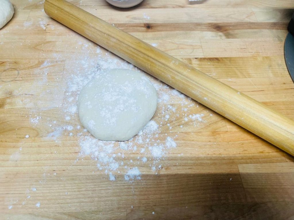 Homemade Pita Bread Recipe: Soft, Fresh & Ready in 90 Minutes 12 pita bread cooking and puffing on a hot skillet