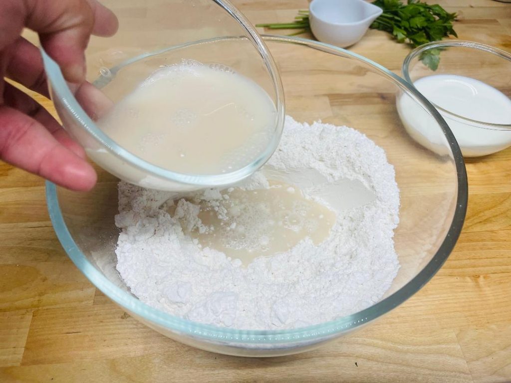 Homemade Pita Bread Recipe: Soft, Fresh & Ready in 90 Minutes 6 pita bread dough coming together in bowl