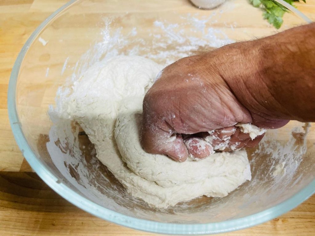 Homemade Pita Bread Recipe: Soft, Fresh & Ready in 90 Minutes 7 pita dough rising in a covered bowl