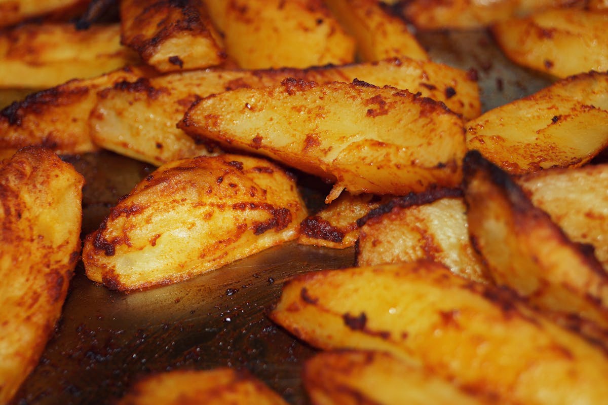 Greek Lemon Potatoes (Patates Lemonates): Crispy, Tangy Roasted Potatoes the Traditional Way 3 Greek lemon roasted potatoes (patates lemonates) in a baking dish