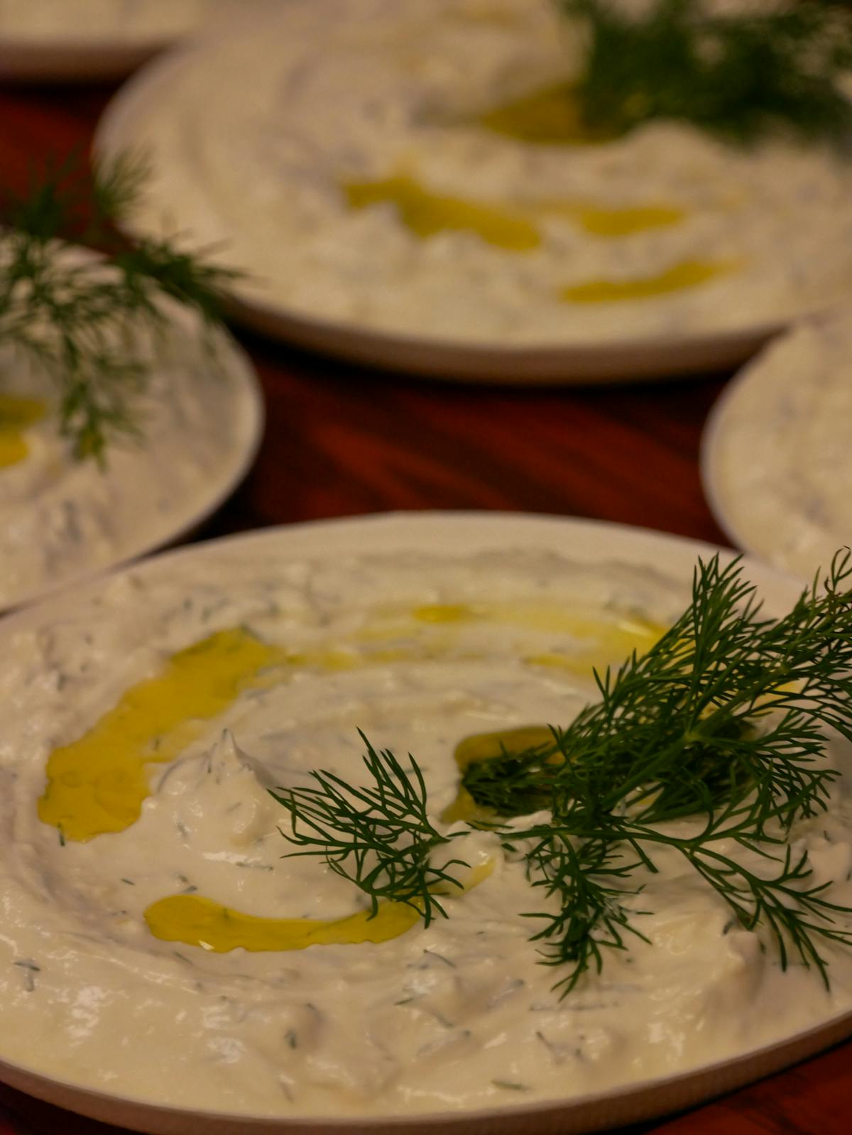 Tzatziki Recipe: The Cool, Creamy Greek Yogurt Dip Done Right 3 Creamy homemade tzatziki dip in a bowl, garnished with fresh dill and a drizzle of olive oil